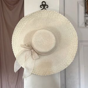 Hand made paper hat with bow like a platinum blonde color